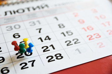 Thumbtack in calendar concept for important date or busy day, appointment and meeting reminder. Pushpin with busy day overworked schedule.
