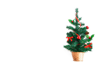 green christmas tree with multi-colored shiny toys balls for the holiday new year