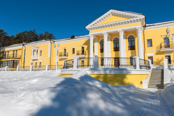 MOSCOW REGION, RUSSIA - MARCH 2, 2019: Country Hotel Bor on a winter day. Located on a hilltop in a coniferous forest on the banks of the river Rozhayka