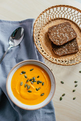 Cream of Pumpkin Soup with toasted bread and pumpkin seeds. Healthy homemade food. Natural food. Vegan diet