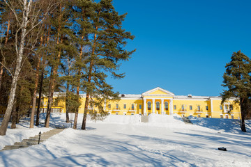 MOSCOW REGION, RUSSIA - MARCH 2, 2019: Country Hotel Bor on a winter day. Located on a hilltop in a coniferous forest on the banks of the river Rozhayka