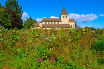 Naklejka premium St. Georg Church on Reichenau Island has been standing here for over 1000 years. There are no buildings from this time in the distance after destructive forces of all kinds. Like a rock of love.