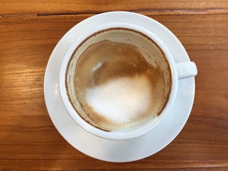 cup of coffee on wooden table