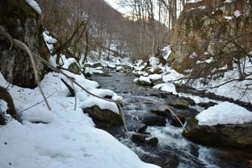 Mountain river in wintertime landscape