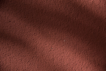 Orange cement and sun light background