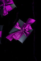 Luxury black gift boxes with green ribbon