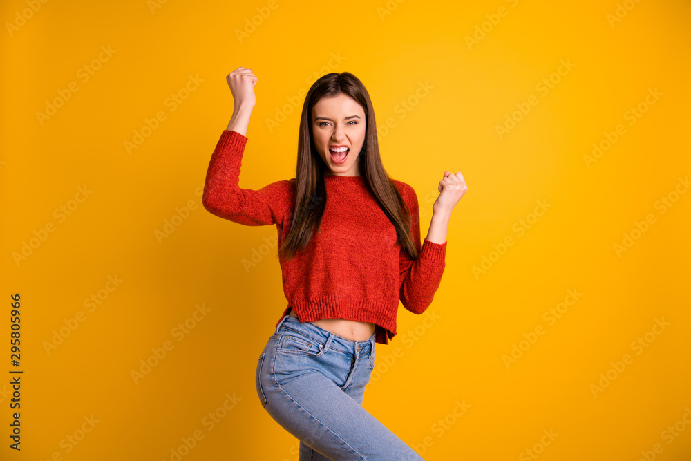 Sticker Photo of cheerful cute nice crazy girl shouting screaming roaring with victorious glory making fists isolated over vibrant color background