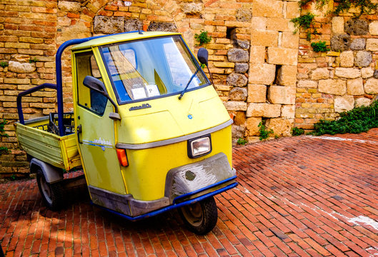 Parma, Italy - August 20: typical old Piaggio APE transpoerter car at the old town on August 20, 2014 in Parma, Italy