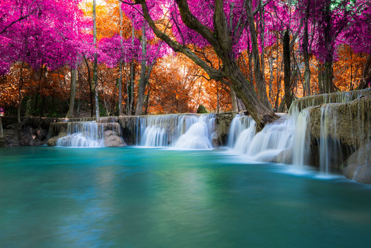 Amazing in nature, beautiful waterfall at colorful autumn forest in fall season