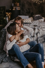 Naklejka premium Romantic couple in love feeling happiness about their romance spending christmas eve together- Image