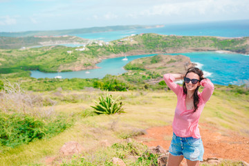 Young woman enjoying breathtaking views of beautiful landscape