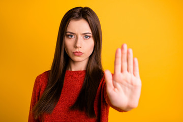 Photo of cute serious confident woman showing you her hand palm for you to stop movement isolated...