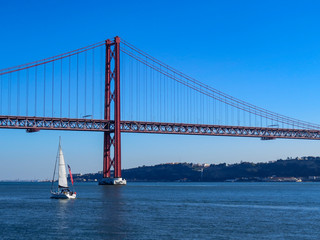 25th April Bridge in Lisbon, Portugal. Famous landmark on river Tagus.