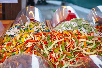 Selective focus, giant snakes jelly and foam sweets on display at Christmas market winter wonderland in London