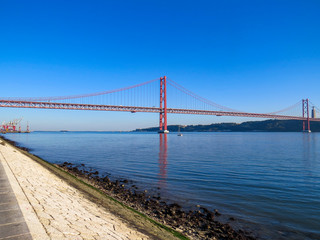 25th April Bridge in Lisbon, Portugal. Famous landmark on river Tagus.