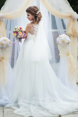 portrait of a young bride in a white dress