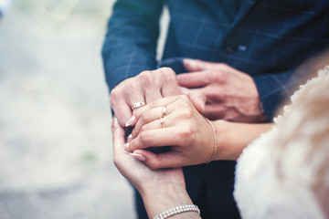 Wedding. Hands of the newlyweds with rings