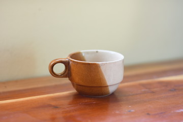 cup of coffee on wooden table