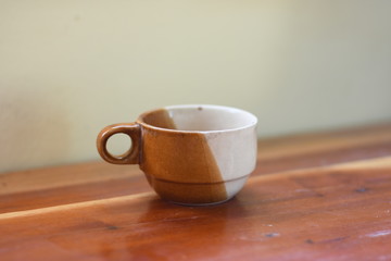 cup of coffee on wooden table