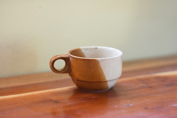 cup of coffee on wooden table