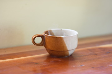 Fototapeta premium cup of coffee on wooden table