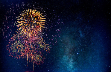 Fireworks with blur milky way background - obrazy, fototapety, plakaty