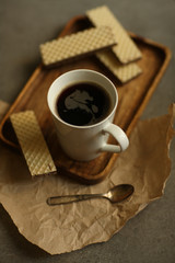 black coffee with waffles on a tray
