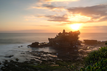 Fototapeta na wymiar Beautiful Sunset View of Tanah Lot Temple in Bali Island