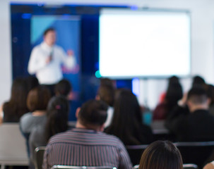 Conference photo audience and speakers giving speech. Seminar presenters on a panel during forum. Corporate managers in sales executive training discussion on stage. Investor pitch presentation.