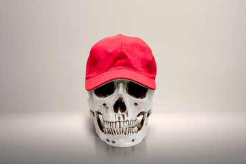 Human skull wearing a red hat