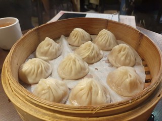 dumplings or dim sum on a table, Taiwanese or Chinese food.