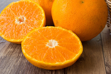Close up, orange slices on wood table
