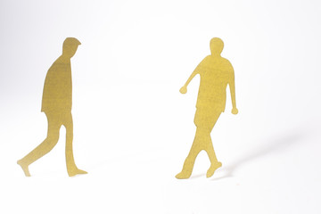 close up of people cut out of paper on white background