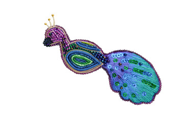 Brooch peacock bird embroidered with gray beads on white background, isolated.