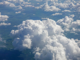 Beautiful aerial view above clouds. Airplane view.