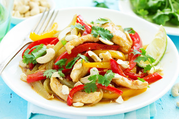 Chicken with vegetables in sweet and sour sauce.