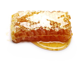 Honeycomb covered with honey isolated on white background