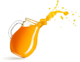 flying pitcher spilling orange juice isolated on white