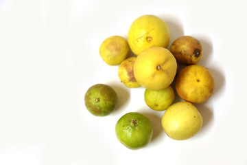 Fototapeta na wymiar fresh and green lemon with tainted lemon on a white background