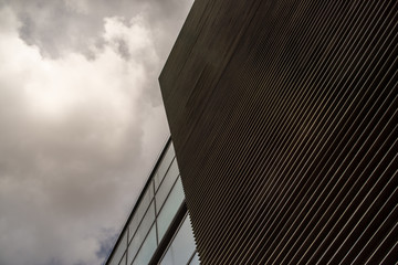 detail of a modern building with steel facade in a cloudy day