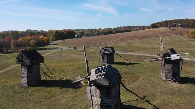 Wooden orthodox church in the village. Paints of golden autumn. Aerial view.