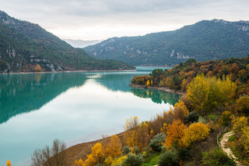 Fototapeta na wymiar Calm lake near mountains in nature