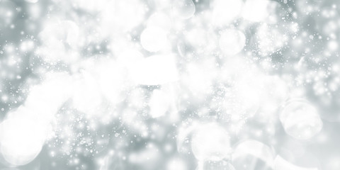 white and grey snows blurred abstract background. bokeh christmas blurred beautiful shiny Christmas lights