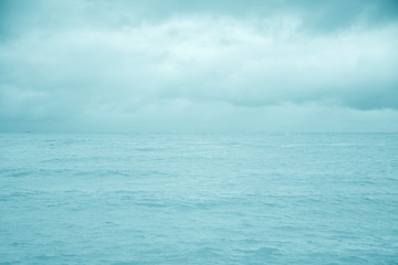 Naklejka na ściany i meble Blue sea with sky clouds for nature background