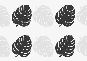 Black and grey monstera leaves seamless wallpaper pattern.