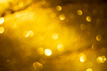 golden blur abstract background. yellow bokeh christmas blurred beautiful shiny Christmas lights