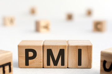 PMI - acronym from wooden blocks with letters, abbreviation PMI Private Mortgage Insurance,...
