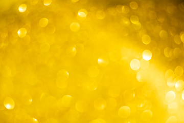 golden blur abstract background. yellow bokeh christmas blurred beautiful shiny Christmas lights