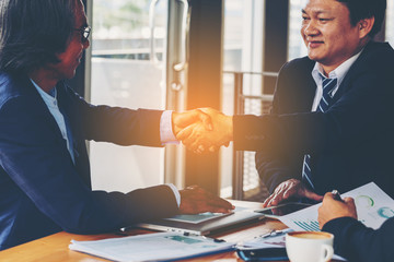 Businessman handshaking process after successful deal