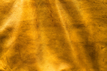 Texture cuir jaune doré avec plis